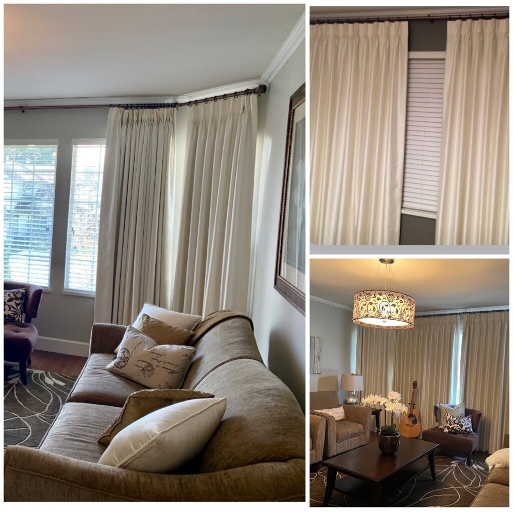 Pinch pleat drapes in living room with plantation shutters