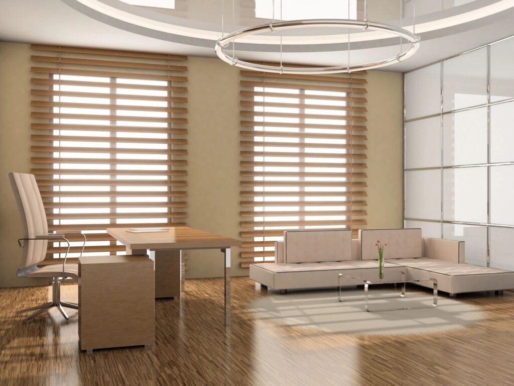 Contemporary office with warm wood zebra blinds and circular pendant